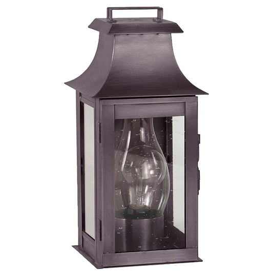 Decorative lantern with a clear glass shade on a white background