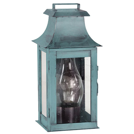Vintage-style teal lantern with a clear glass cover on a white background
