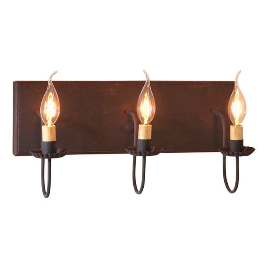 A black vanity light fixture with red stripes, featuring three hanging lights with bulb encasements, designed to be mounted over a mirror.
