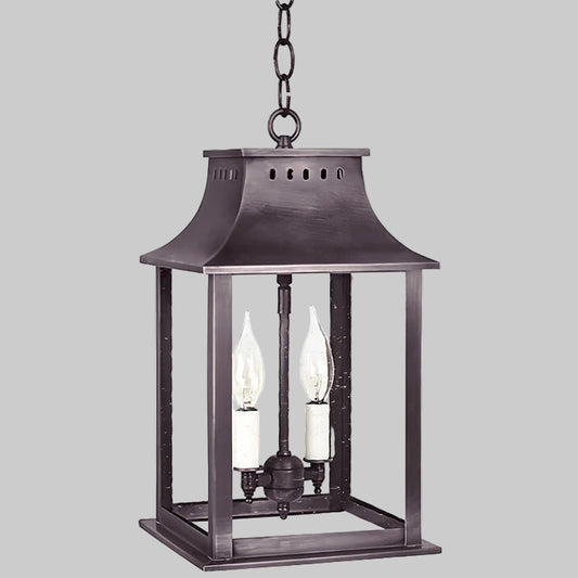 Decorative hanging lantern with two candle-like lights on a white background