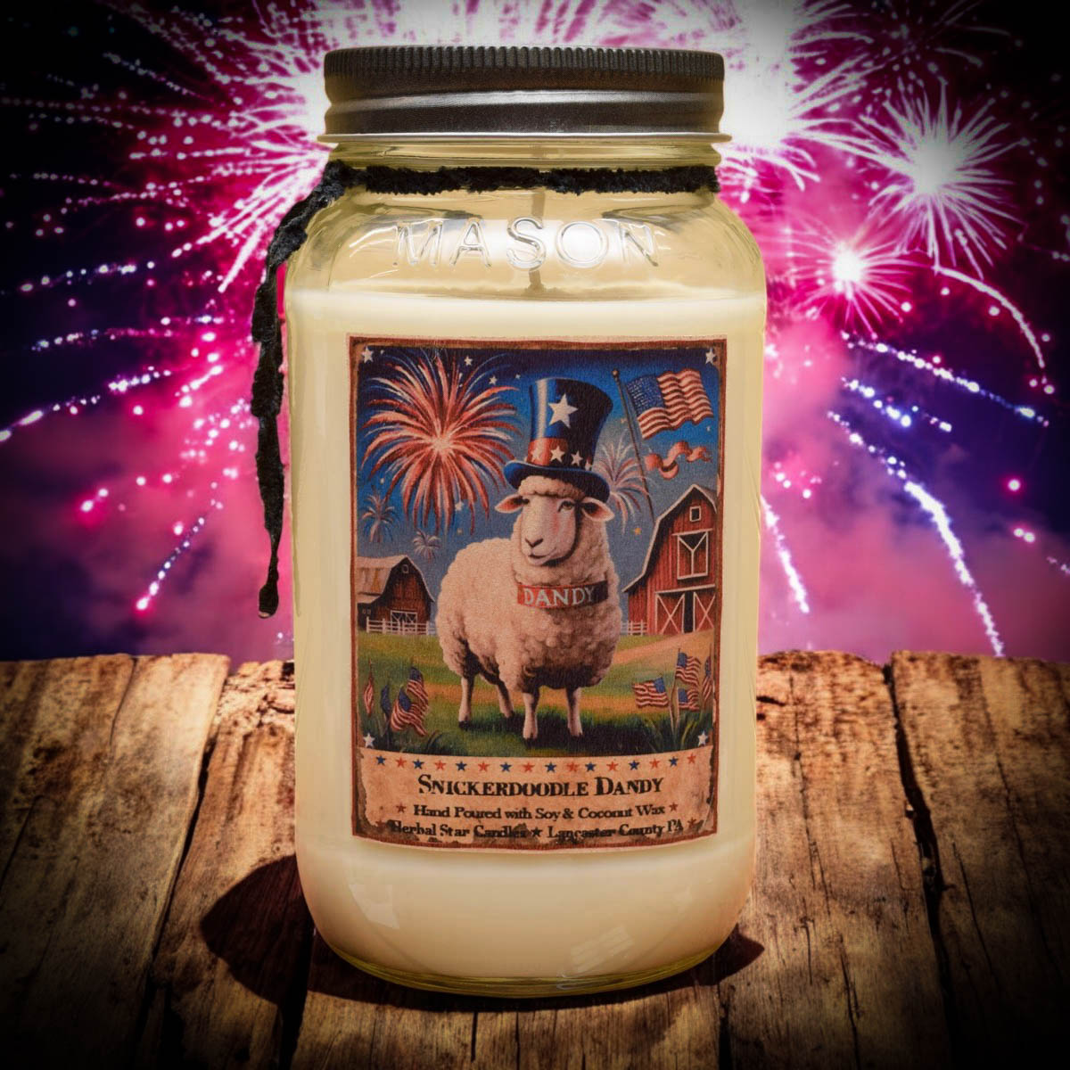 Candle jar with a label featuring a sheep and American-themed design, set against a vibrant fireworks display.