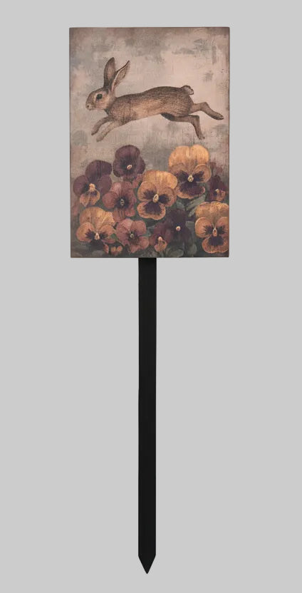 Decorative garden stake with a rabbit and flowers design on a gray background