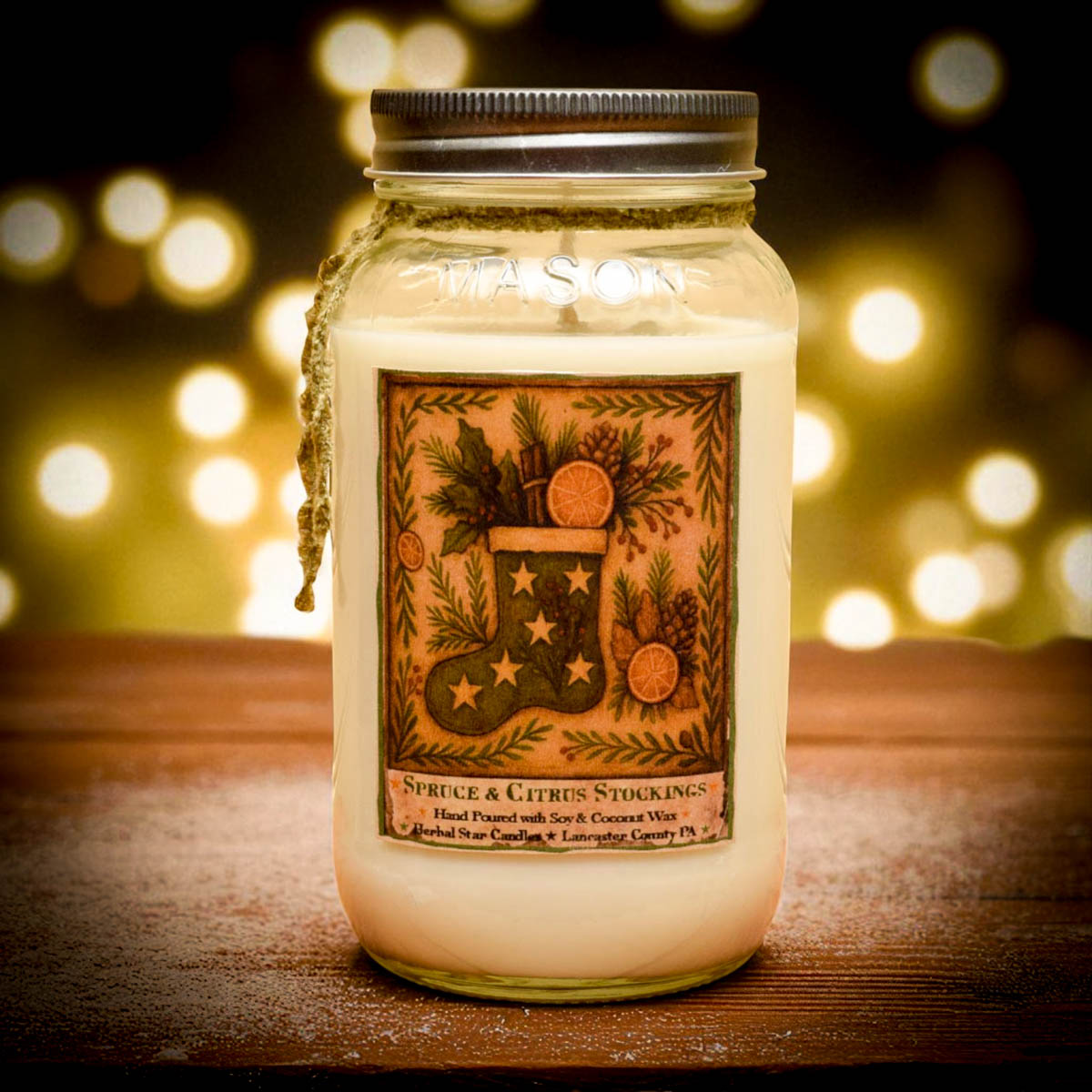 Jar candle with decorative label on a wooden surface with blurred lights in the background
