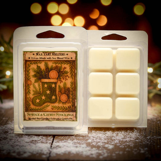 Pack of wax melts with a Christmas-themed label on a wooden surface with blurred lights in the background.