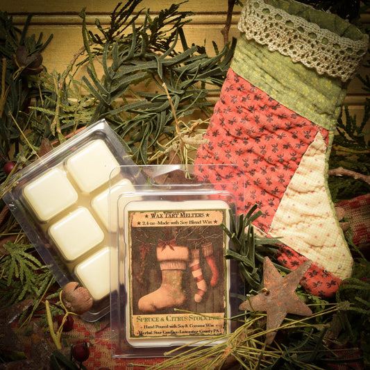 Mini pack of 6 wax tarts named 'Spruce and Citrus Stockings' placed in a Christmas-themed setting with holiday decorations around.