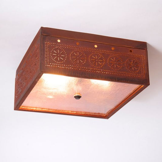 Rustic tin ceiling light fixture with embossed design on a white background
