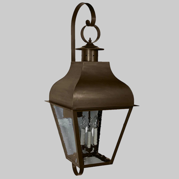 Bronze outdoor wall lantern on a white background