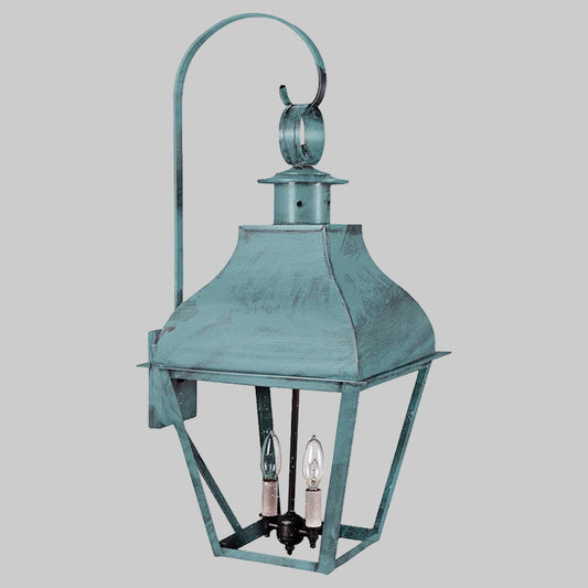 Vintage-style metal lantern with two light bulbs on a white background