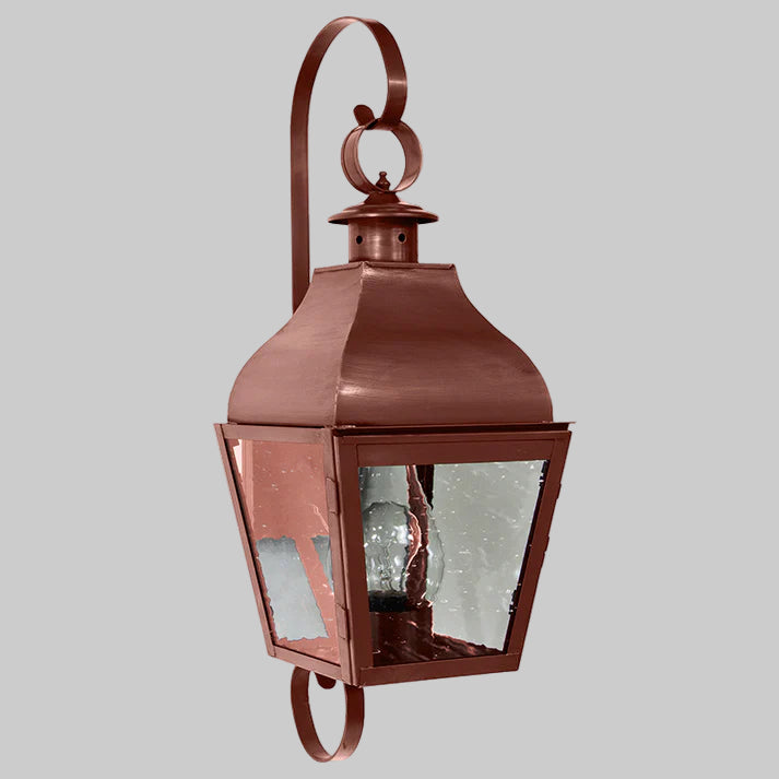 Copper outdoor wall lantern on a white background