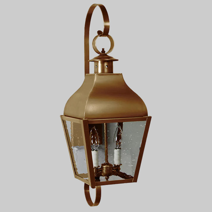 Bronze outdoor wall lantern with glass panels on a white background