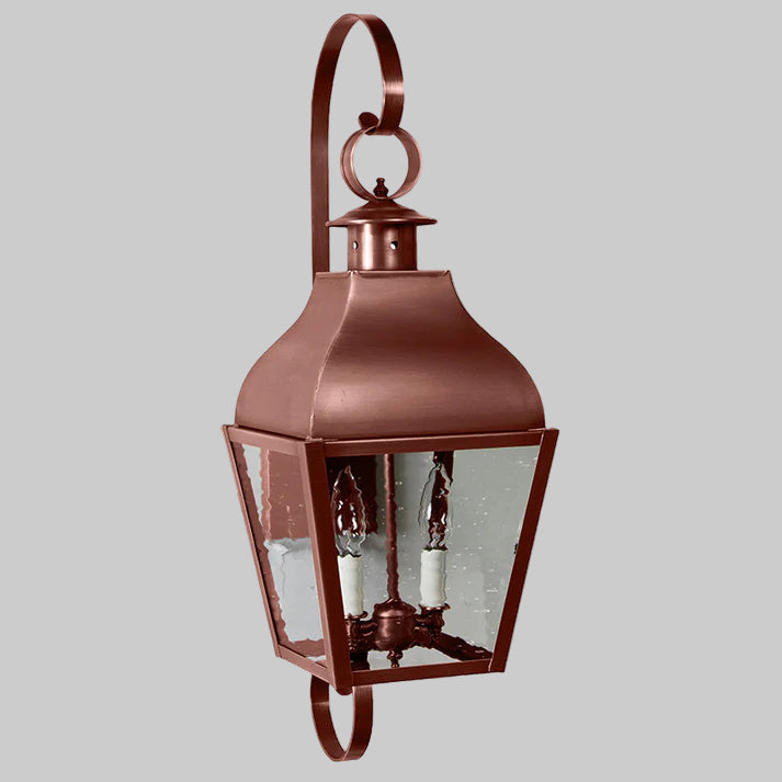 Copper outdoor wall lantern on a white background