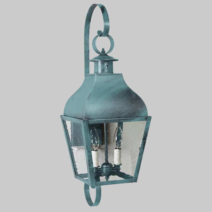 Vintage-style teal lantern with clear glass on a white background