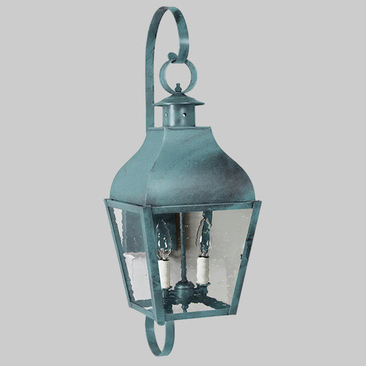 Vintage-style teal lantern with clear glass on a white background