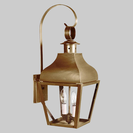 Brass outdoor wall lantern on a white background