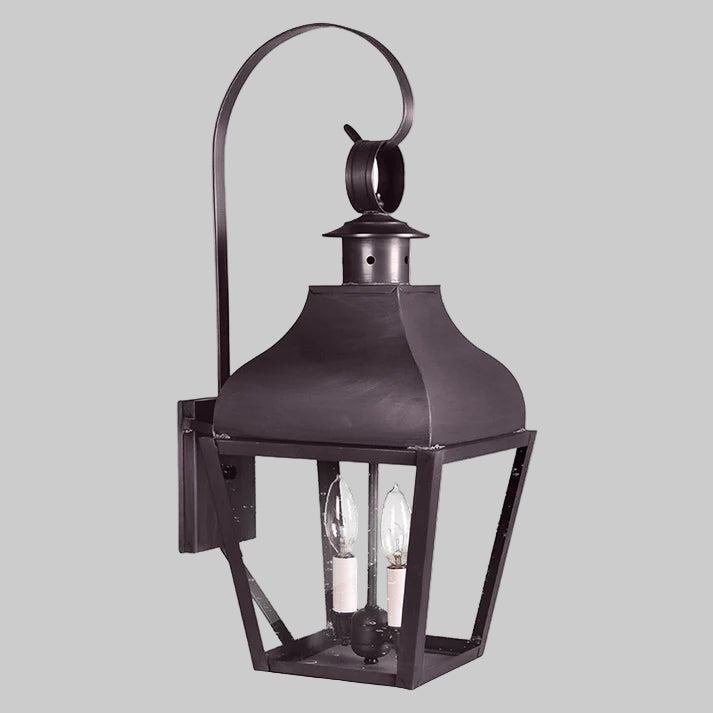 Decorative outdoor wall light fixture on a white background