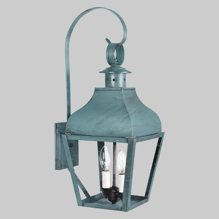 Vintage-style wall lantern with a greenish-blue finish on a white background