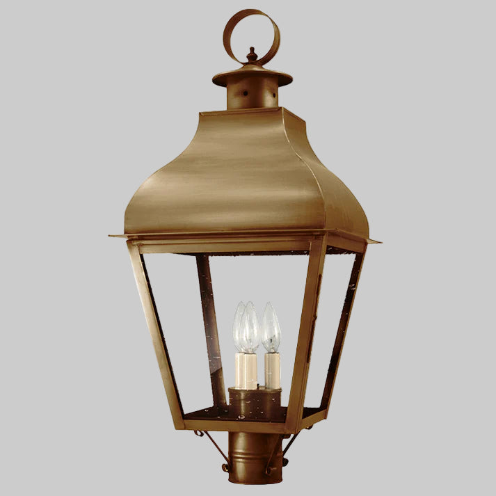 Bronze outdoor lantern with clear glass on a gray background