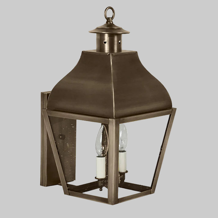 Bronze outdoor lantern with clear glass on a gray background