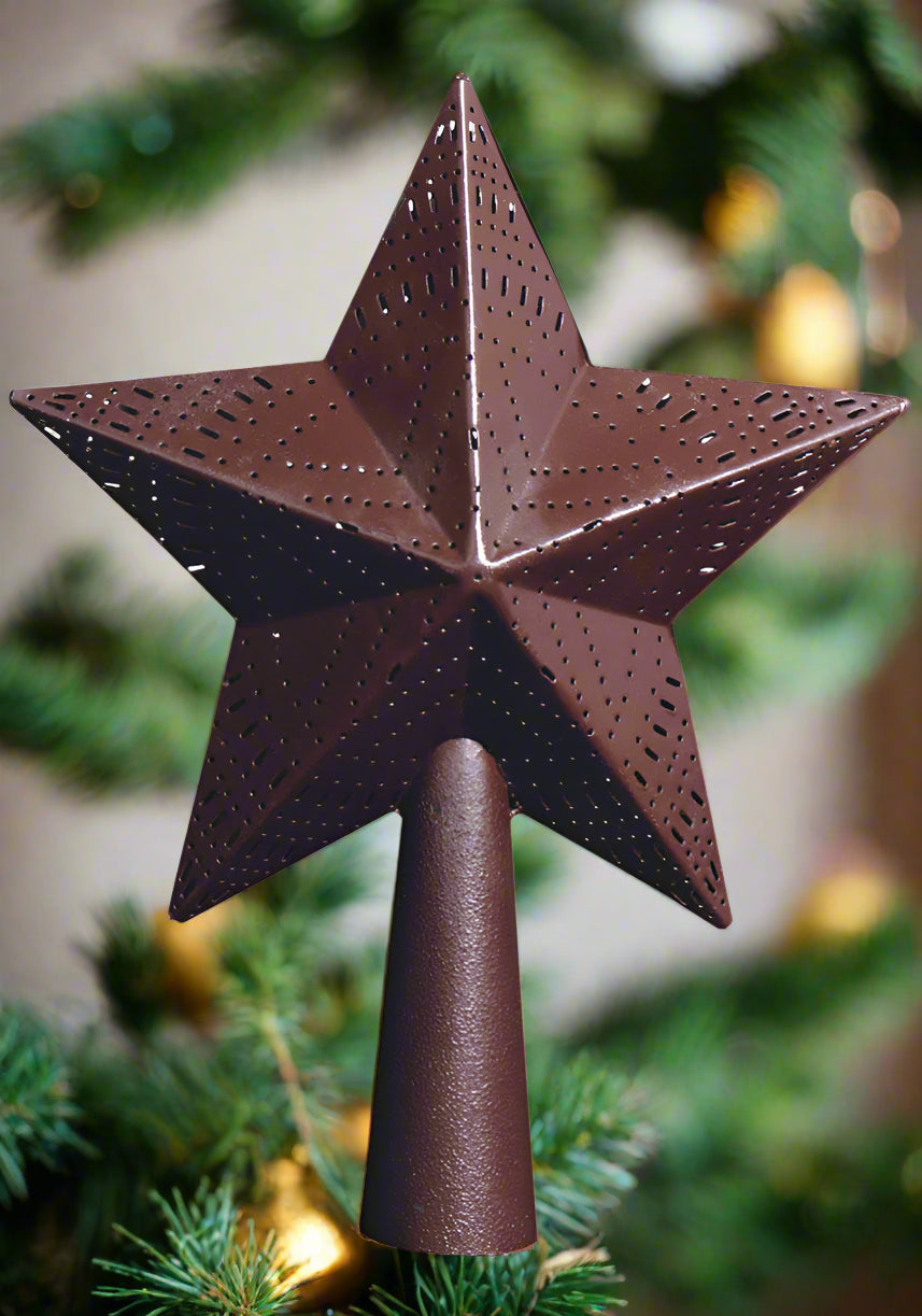 Star tree topper large in wine color on top of Christmas tree