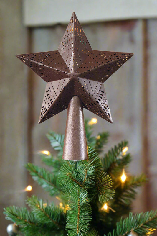 A wine star-shaped tree topper shown on top of a Christmas tree