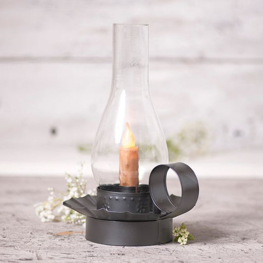 Tin candleholder with globe to accommodate a real or battery operated taper candle.