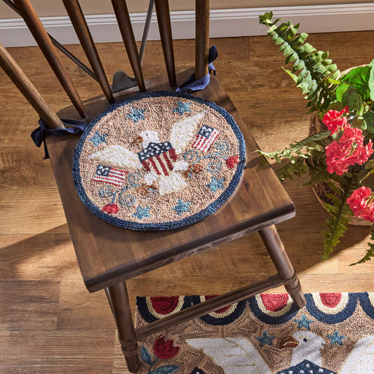 Decorative rug with eagle and American flag design on a wooden chair.