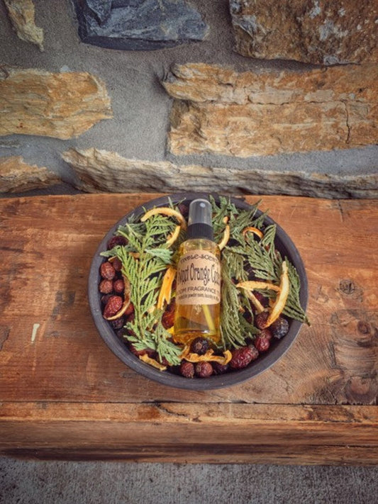 Metal pan with potpourri and a bottle of scented oil