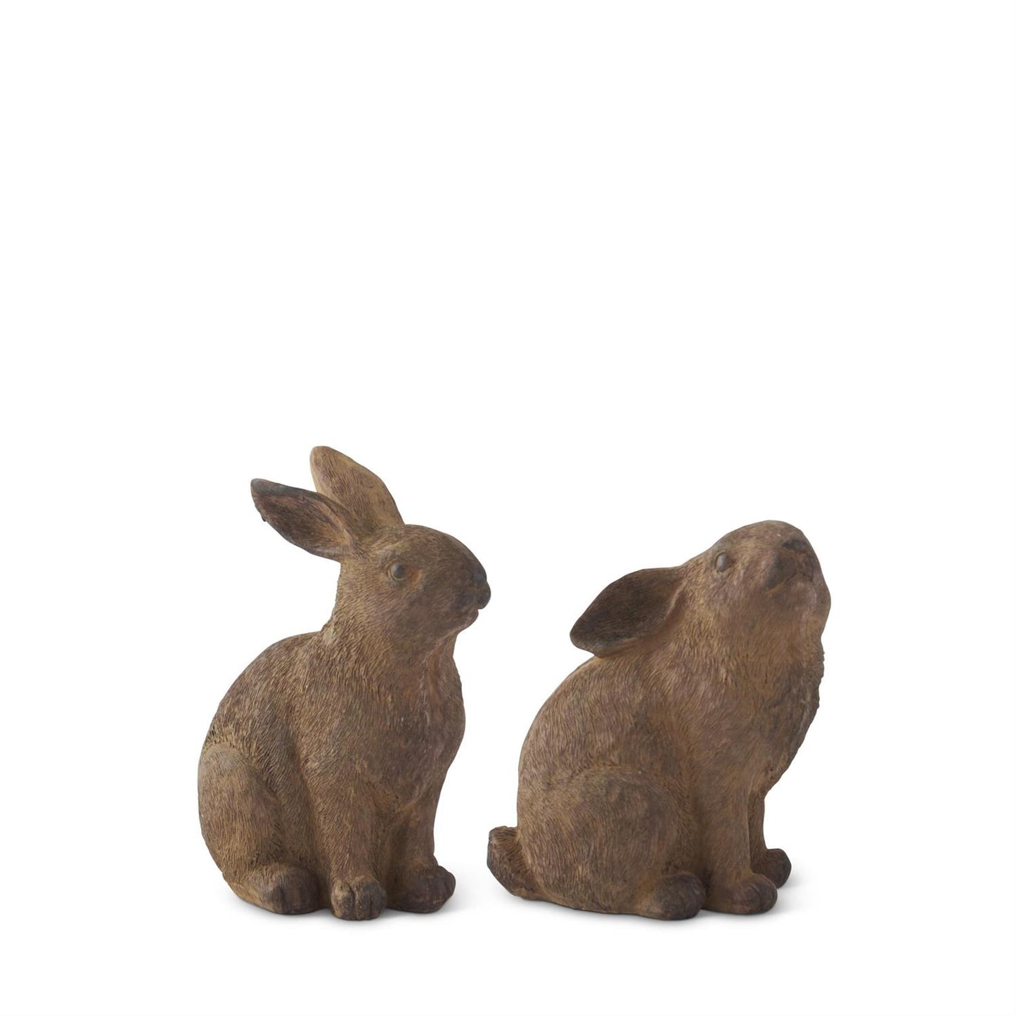Two brown rabbit statues on a white background