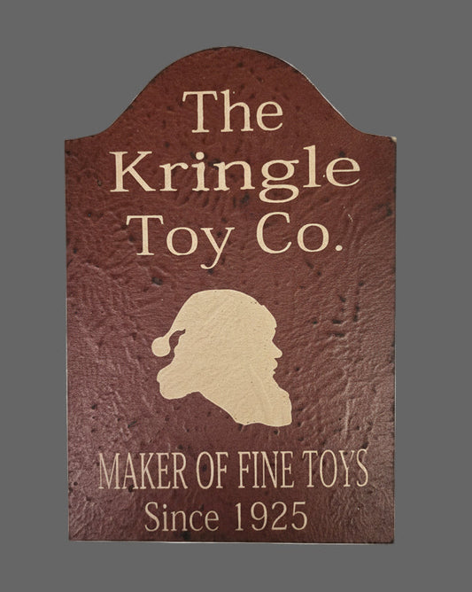 Logo of The Kringle Toy Co. with a silhouette of Santa Claus on a textured brown background.