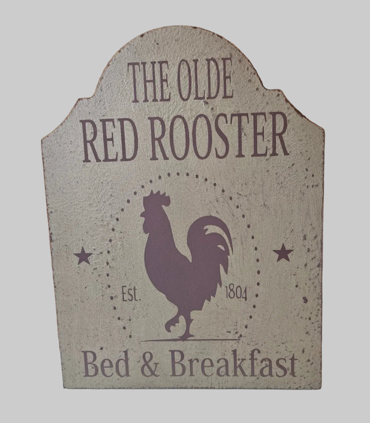Decorative sign for 'The Olde Red Rooster Bed & Breakfast' with a rooster silhouette.