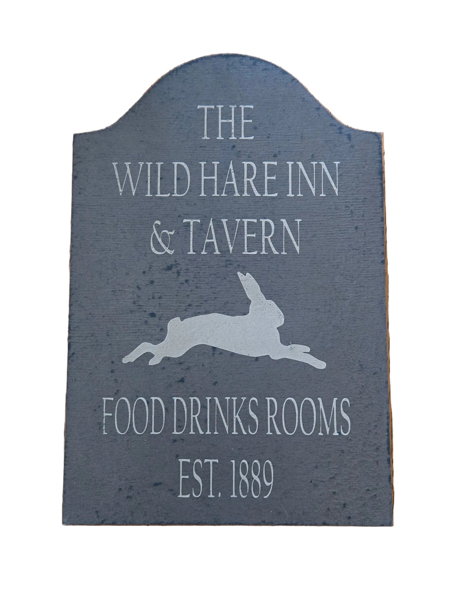 Decorative sign for The Wild Hare Inn & Tavern with a rabbit silhouette.