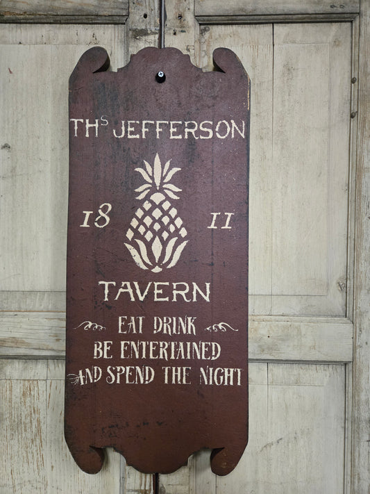 Wooden sign with text and pineapple design on a wooden background