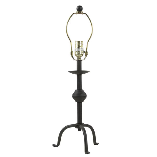 Black metal table lamp with a decorative base on a white background