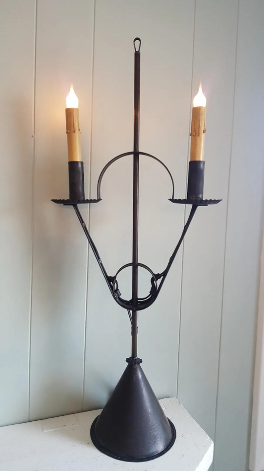 Tin table lamp on a triangular base with two candelabras electrified for lightbulbs