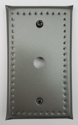 Gray wall plate with a hole cut out for a cable connection and with a border punch design