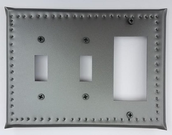 A tin double switch/single ground fault border punch, featuring a gray metal plate with multiple mounting holes and two switch cut-outs.