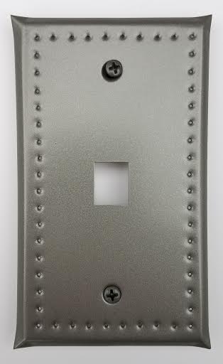 Wall cover with cutout for a phone connection with a punched tin border design