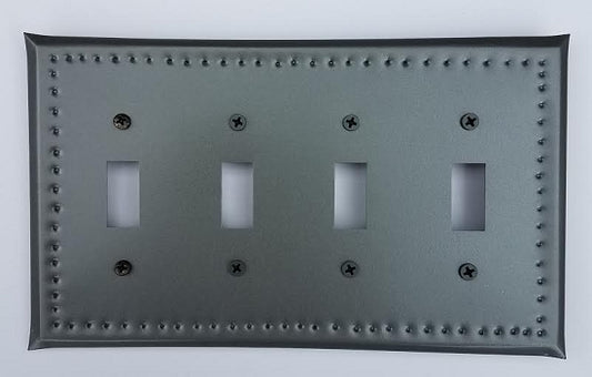 A tin quad switch plate with border punch design, featuring a gray color and multiple mounting holes.