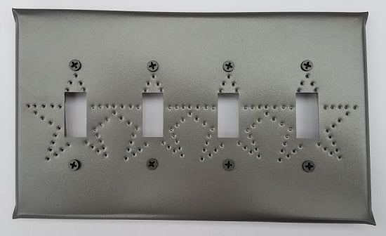 A tin quad switch plate with star punch design, featuring a border and star patterns with visible screw holes.