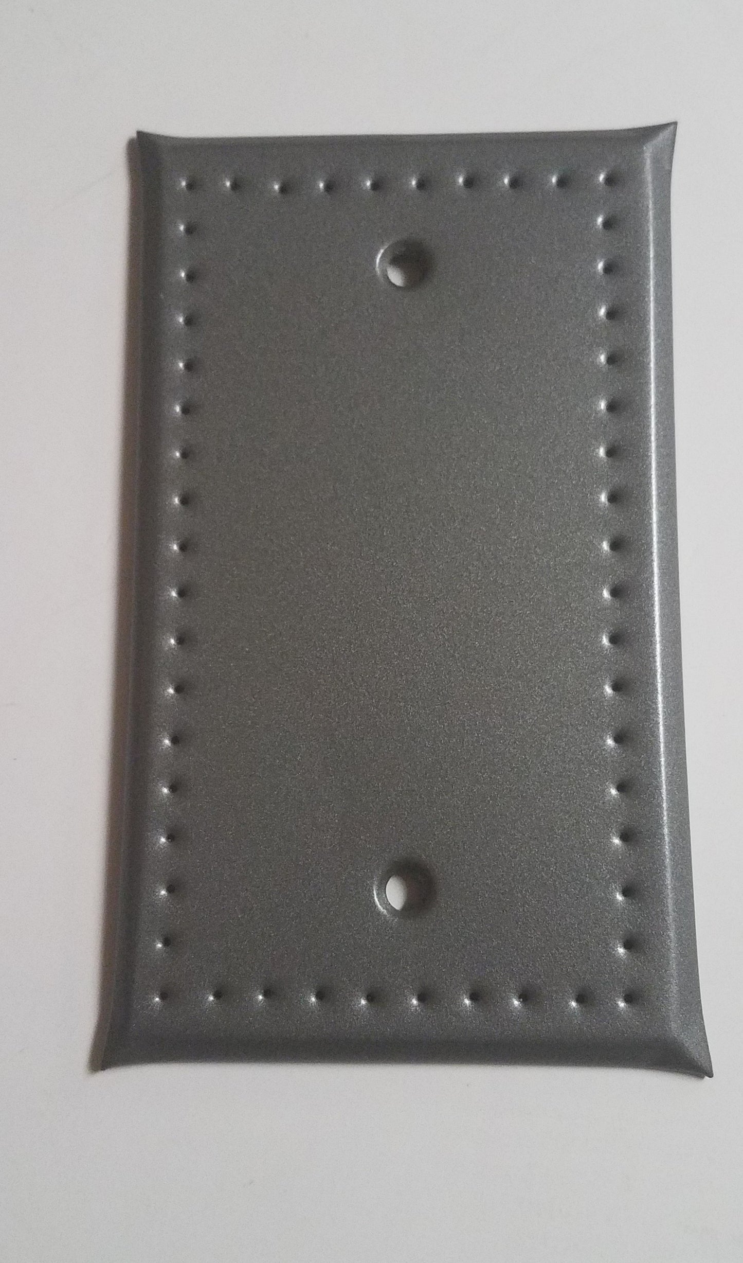 Punched tin cover with no holes for switches or outlets