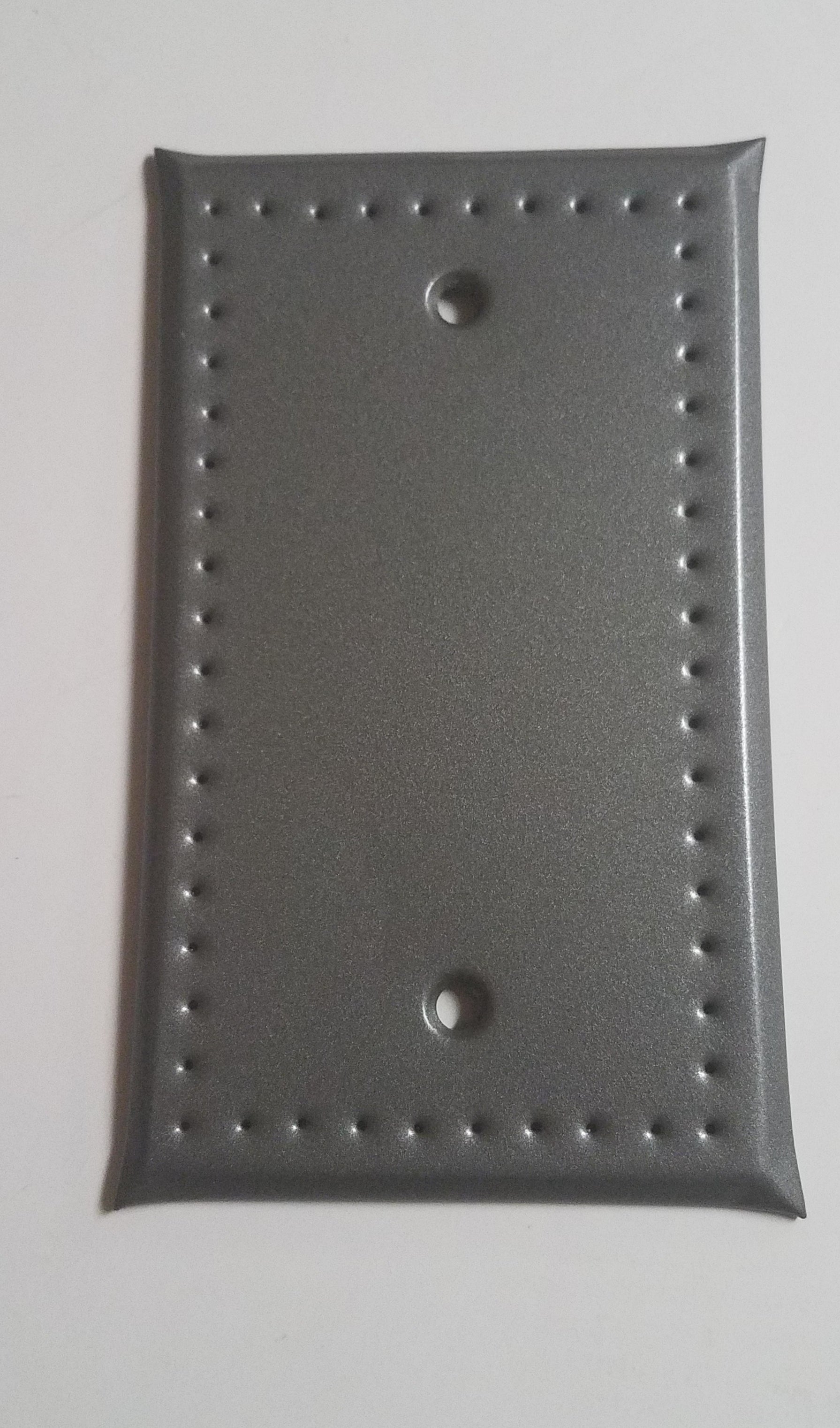 Punched tin cover with no holes for switches or outlets