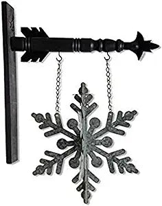 Metal snowflake hanging from a black arrow on white background.