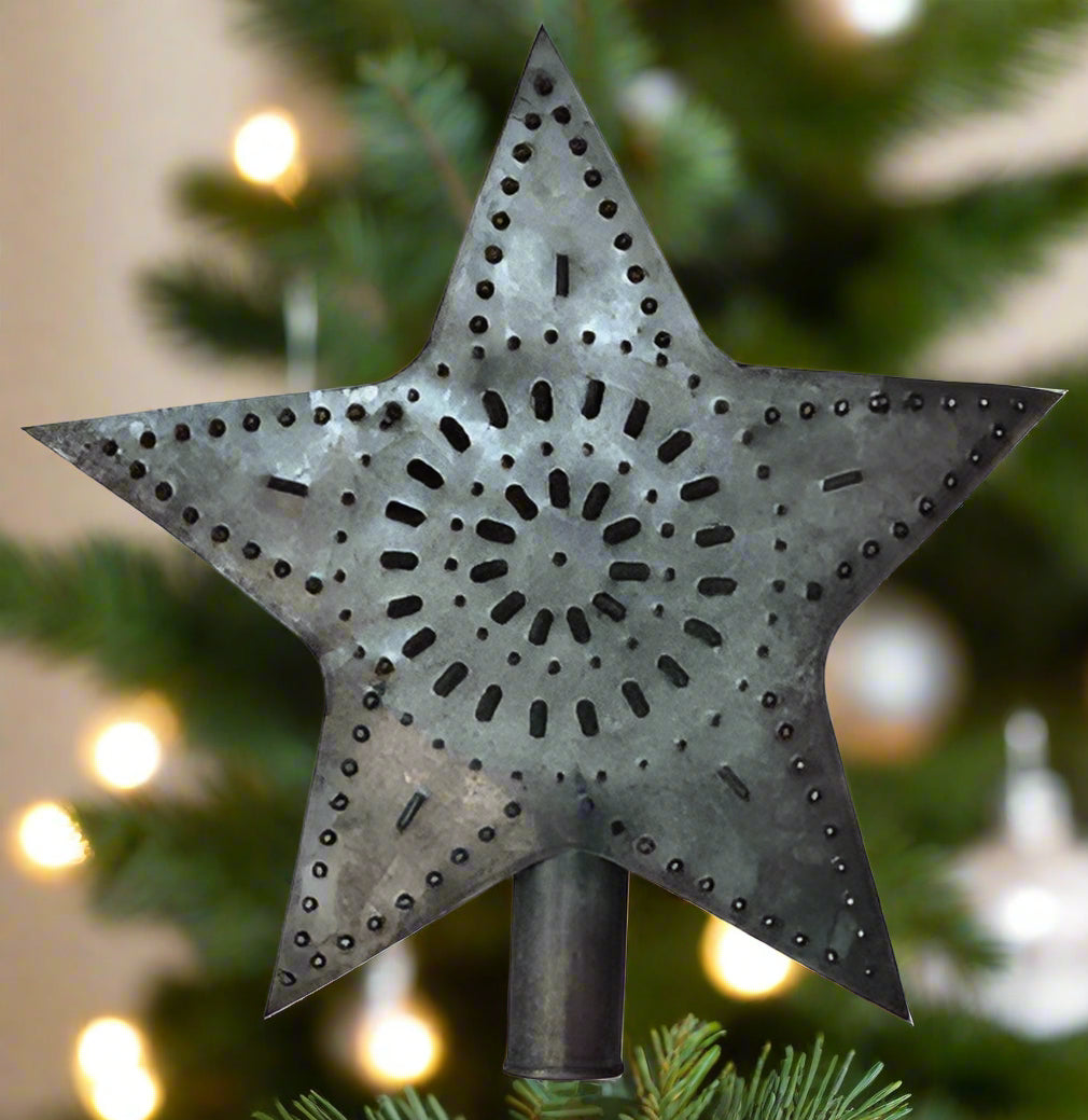 Tin star tree topper on white background