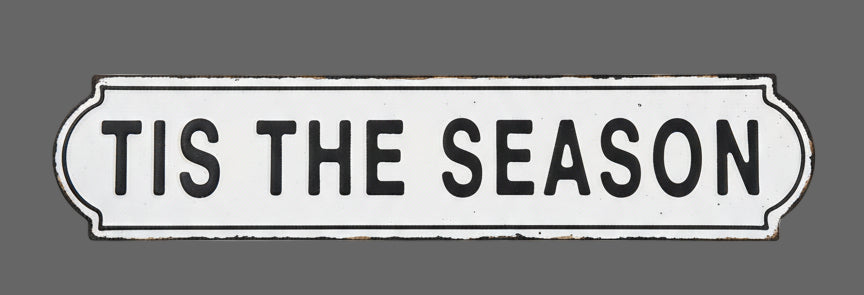 Decorative sign with 'TIS THE SEASON' text on a textured surface