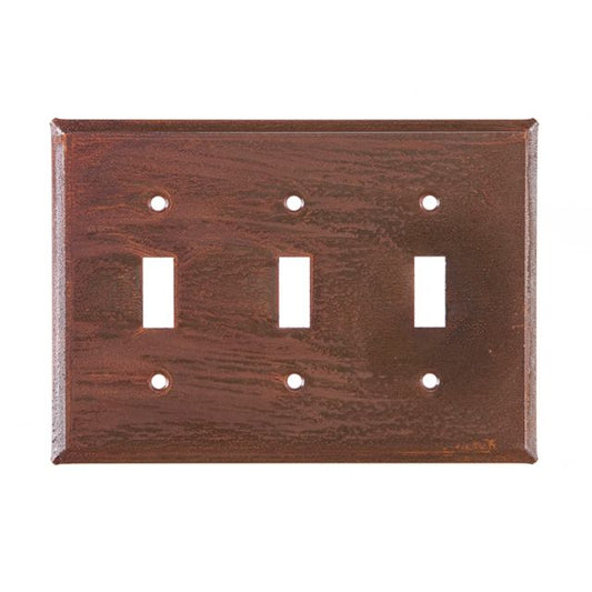 A rustic tin triple switch cover with a matte lacquer protective coating.