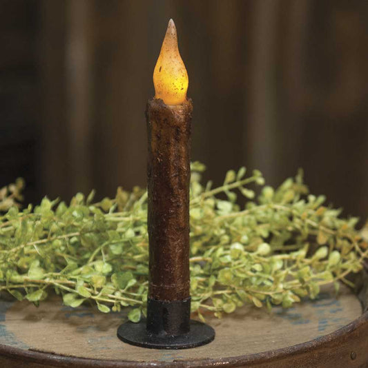 Twisted flame timer taper burnt mustard in circle iron candle holder with baby grass greenery