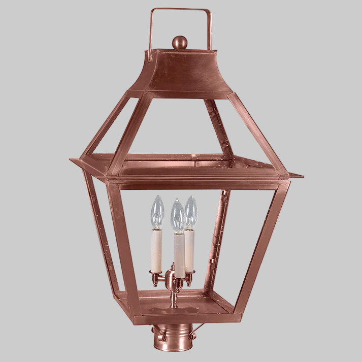 Copper outdoor lantern with two light bulbs on a gray background