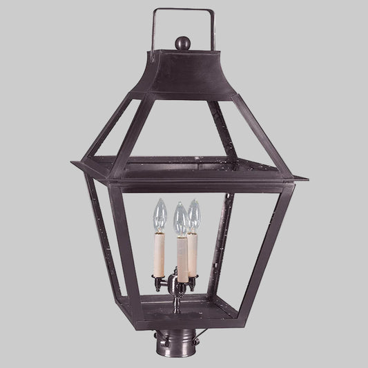 Traditional outdoor lantern with two candle-like lights on a gray background