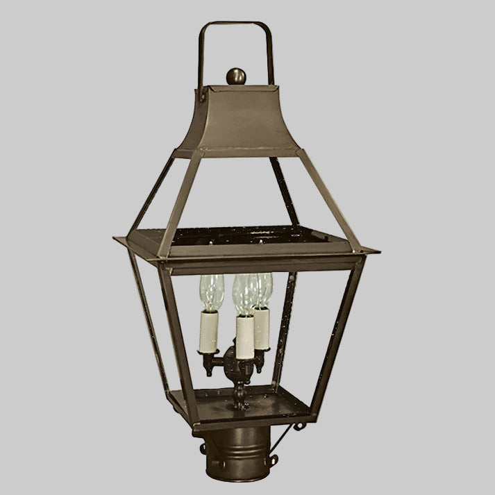 Vintage-style outdoor lamp with three light bulbs on a gray background