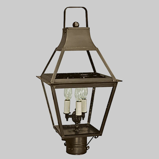 Vintage-style outdoor lamp with three light bulbs on a gray background